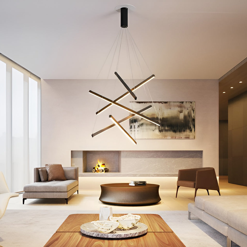 Criss linear chandelier in gold and black, providing elegant lighting for a modern living room.