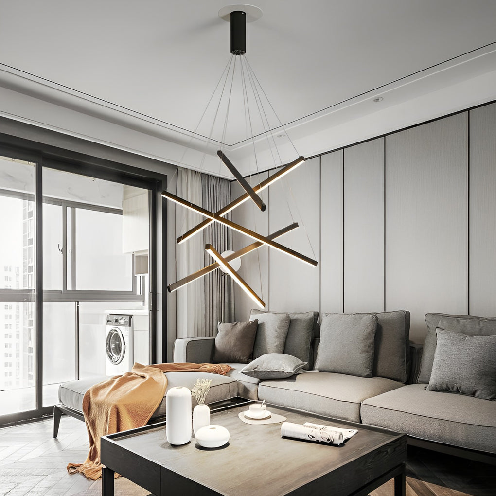 Criss linear chandelier with minimalist gold and black design, enhancing a sophisticated living space.