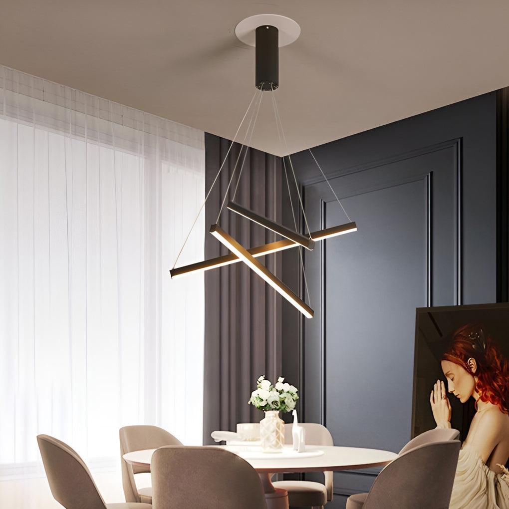 Criss linear chandelier featuring sleek gold and black lines, illuminating a contemporary living room.